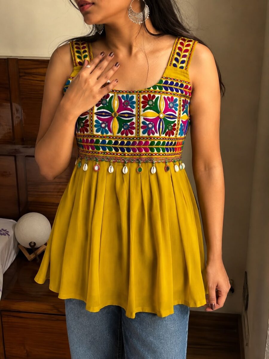 Mustard yellow Gamthi embroidered sleeveless peplum top