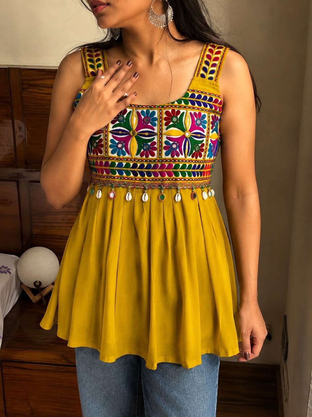 Mustard yellow Gamthi embroidered sleeveless peplum top